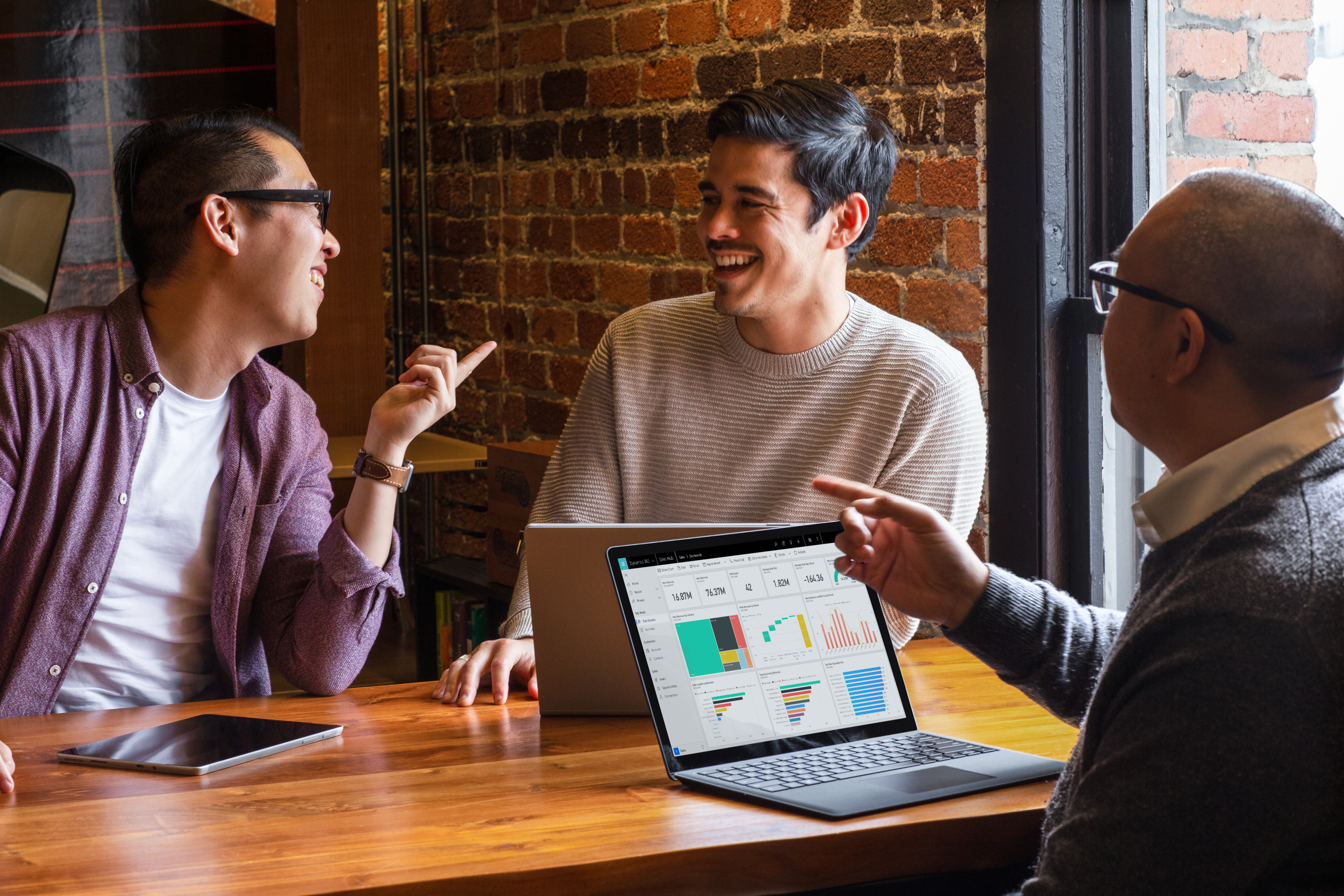 A group of coworkers laughing.