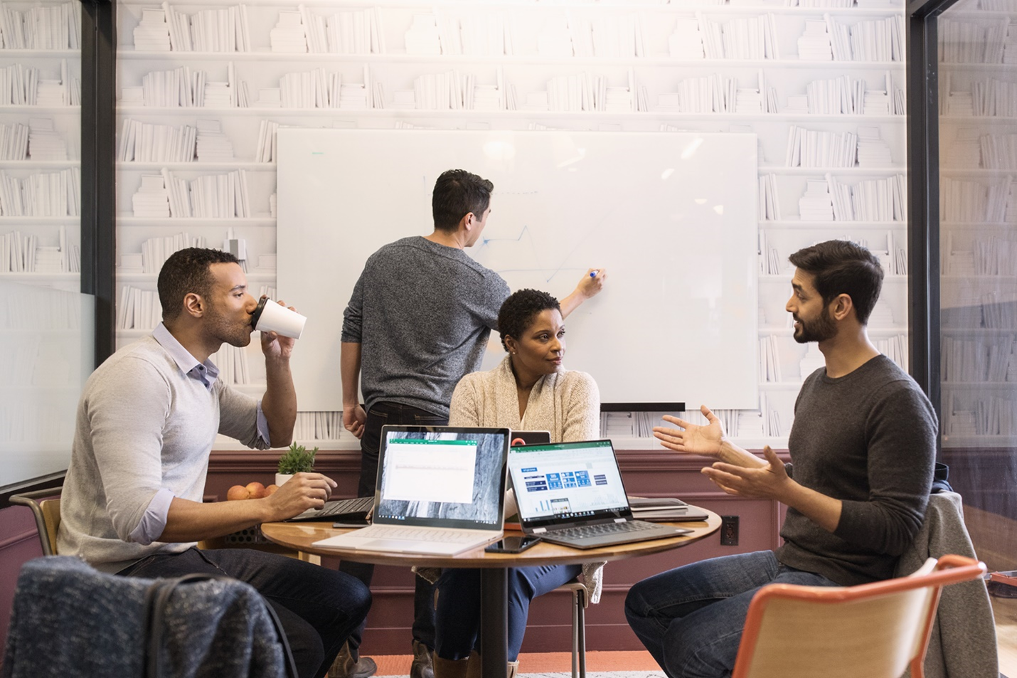 A photograph showing a group of diverse people in meeting.