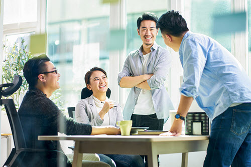 Photograph showing people holding discussion in a team meeting.