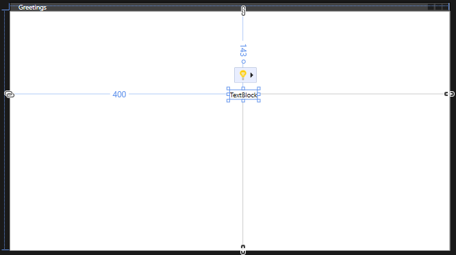Screenshot showing the TextBlock control positioned on the Greetings form with the guidelines visible.