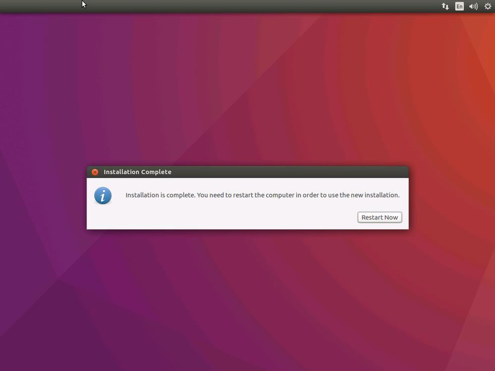 Screenshot of the Ubuntu install's installation complete, restart now screen.
