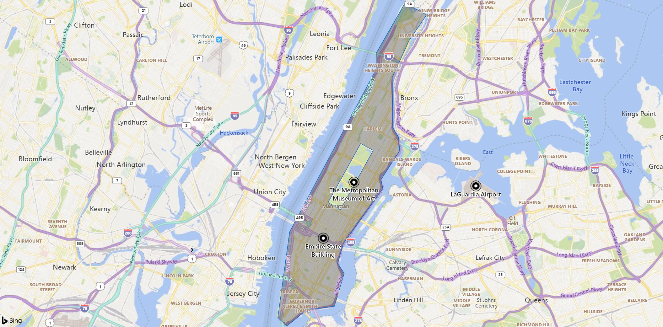 マンハッタンエリアの地図のスクリーンショット。ランドマーク、博物館、空港のマーカーが表示されています。島はセントラルパークを除いて淡色表示されます。